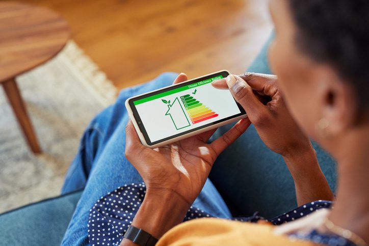 WOman checking house energy efficiency on phone